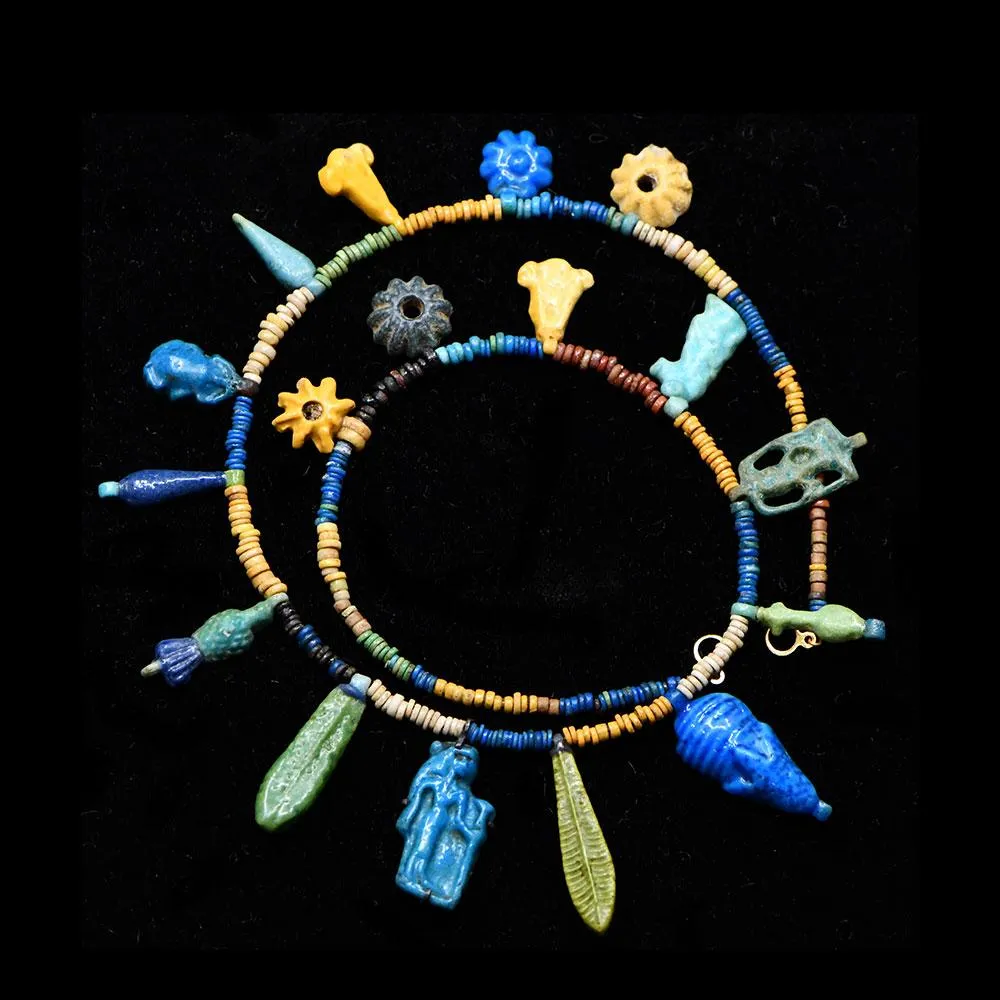 An Exhibited Egyptian Bead and Amulet Faience Necklace, Amarna Period, ca. 1353–1336 BCE