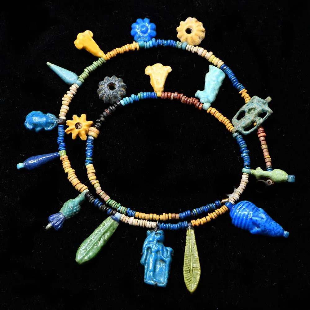 An Exhibited Egyptian Bead and Amulet Faience Necklace, Amarna Period, ca. 1353–1336 BCE