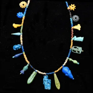 An Exhibited Egyptian Bead and Amulet Faience Necklace, Amarna Period, ca. 1353–1336 BCE