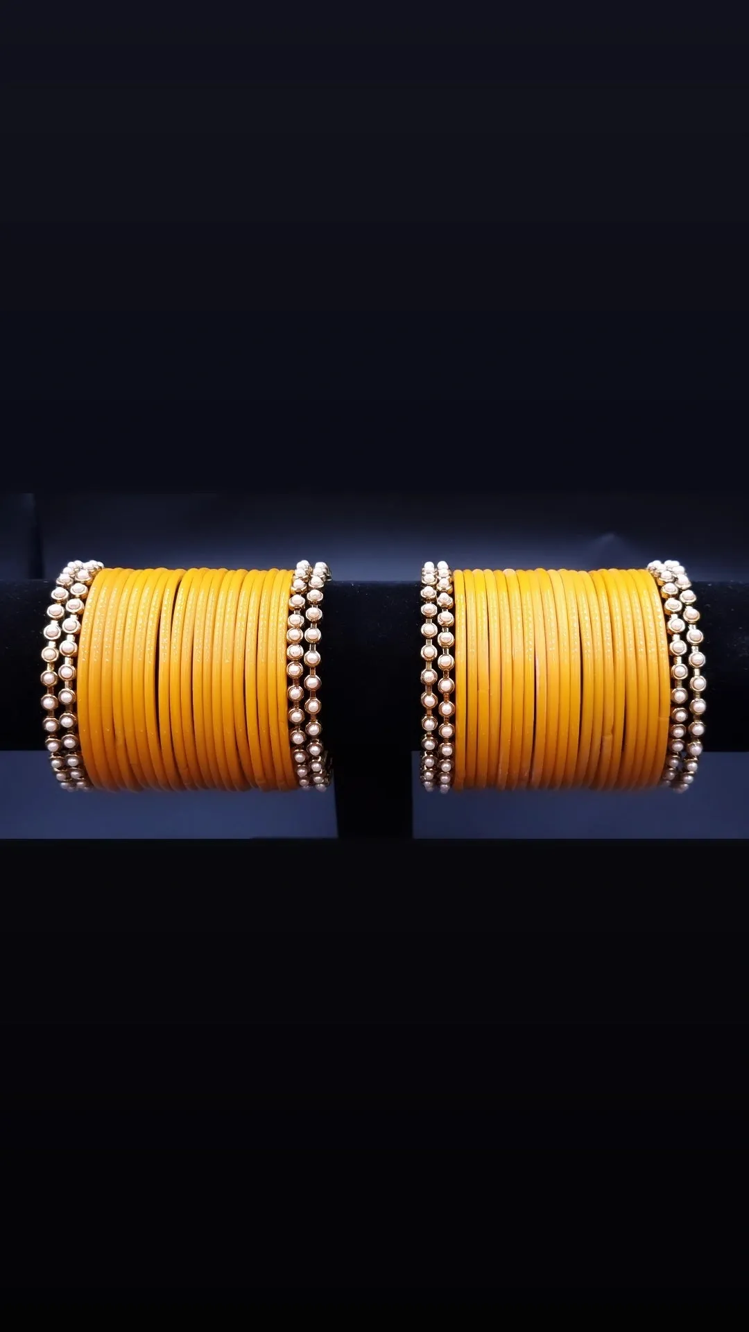 Designer yellow glass bangles with pearl metal bangles set. ( 2.8 )